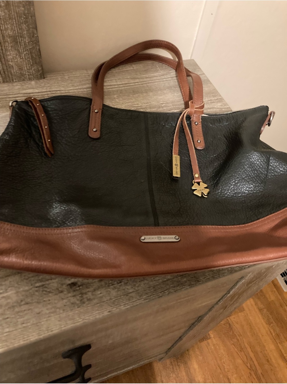 Lucky Brand Black and Brown Leather Tote with Gold Accent Charm